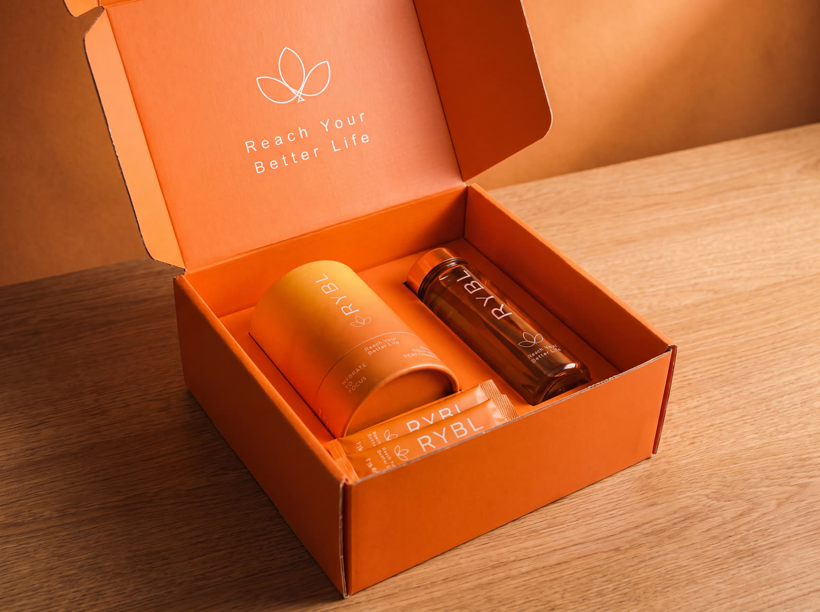 The RYBL gift box, open — tube, bottle and stick inside